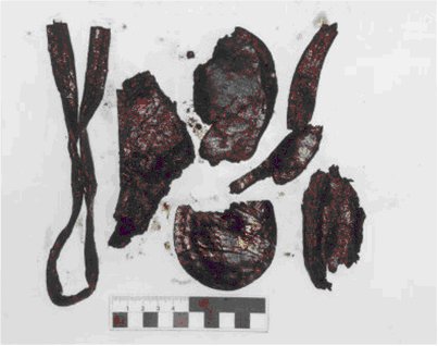9 Leather fragments including a welt fragment quarter section seat stiffener and heel piece